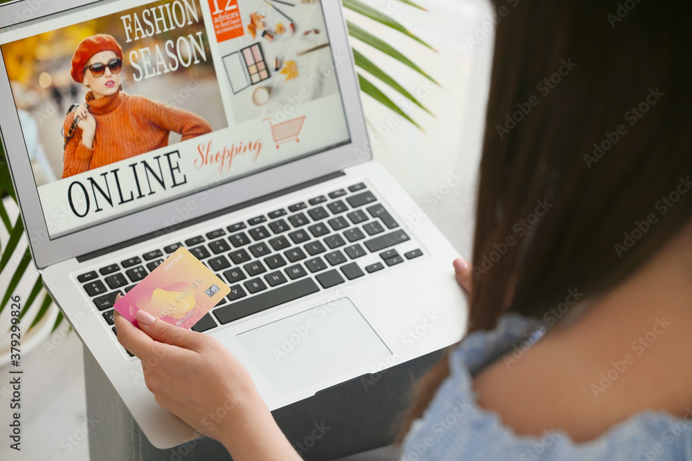 Young woman shopping online at home