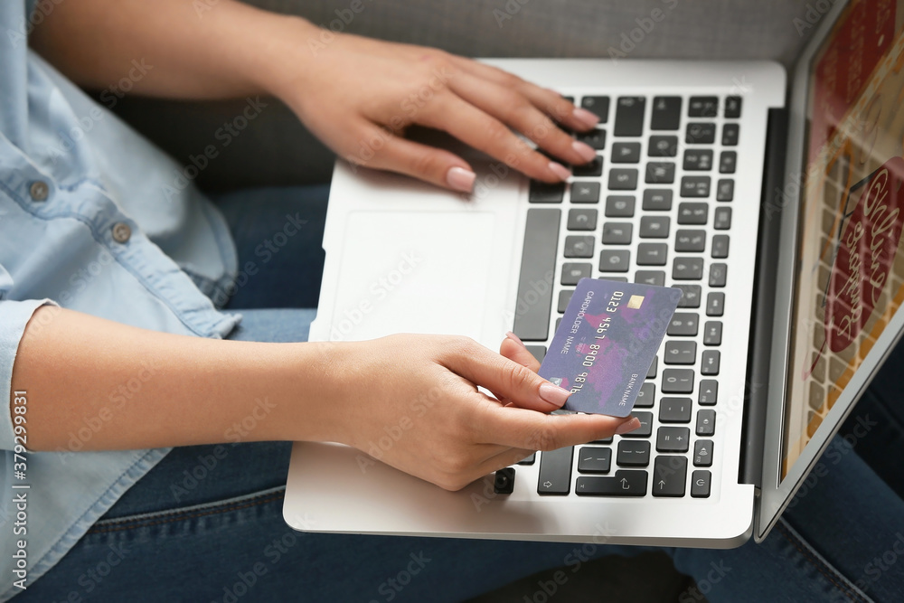 Young woman shopping online at home