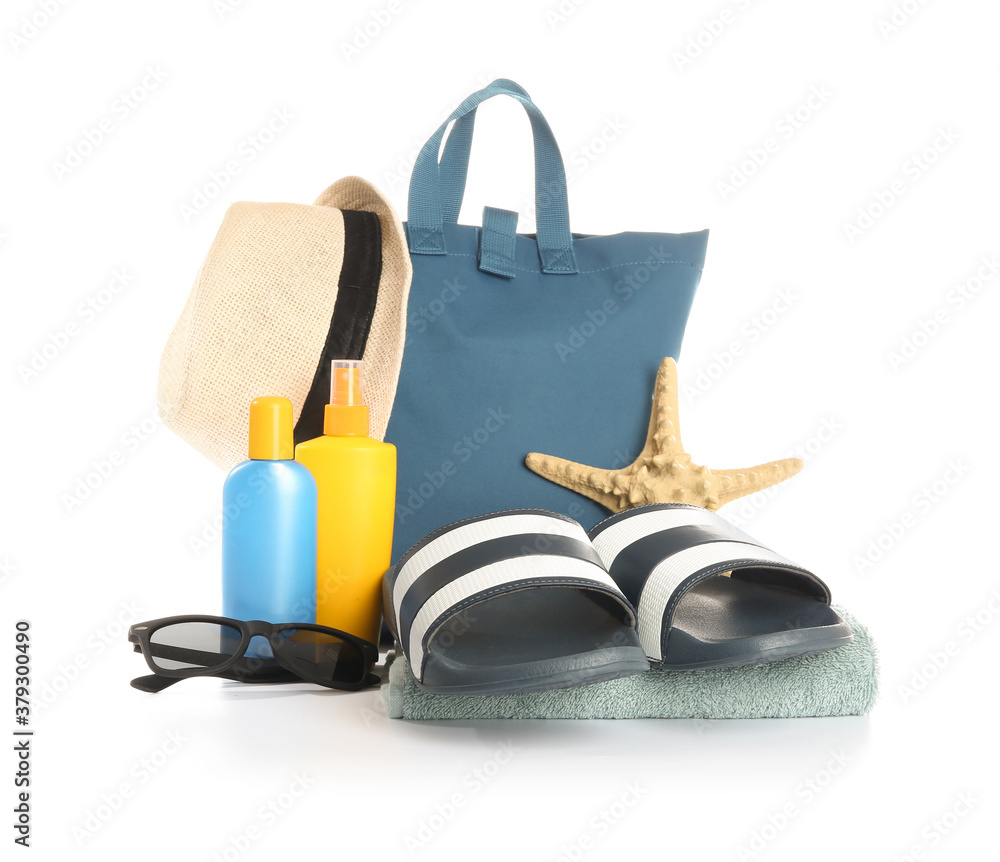 Set of beach accessories on white background