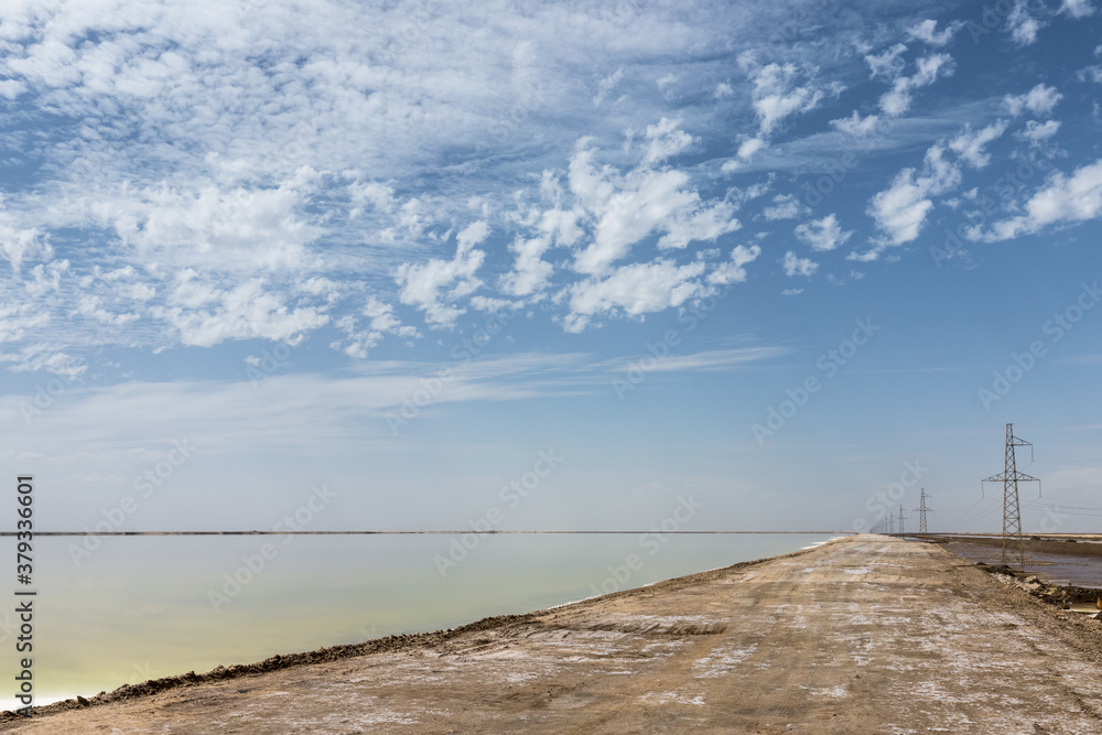 salt lake with simple dirt road