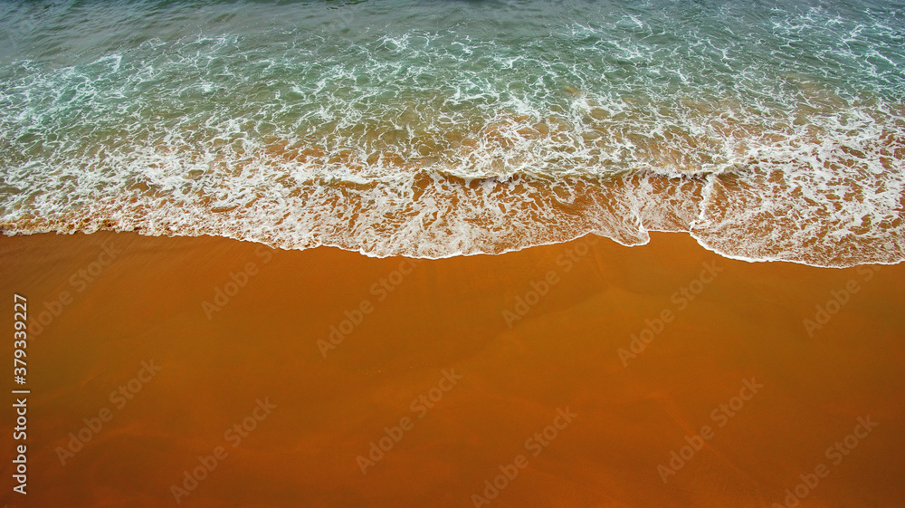 Aerial view of transparent turquoise sea and beach