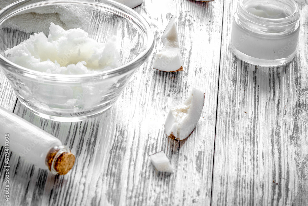 organic cosmetics with coconut on wooden background close up