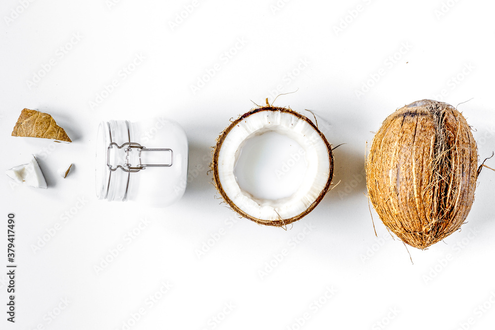 organic cosmetics with coconut on white background top view