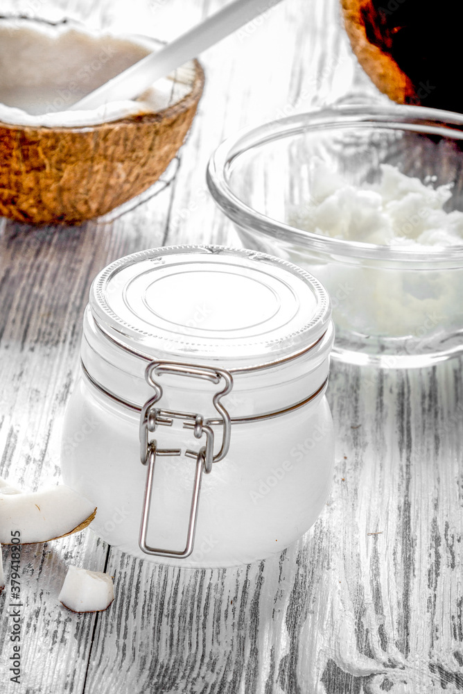 organic cosmetics with coconut on wooden background close up