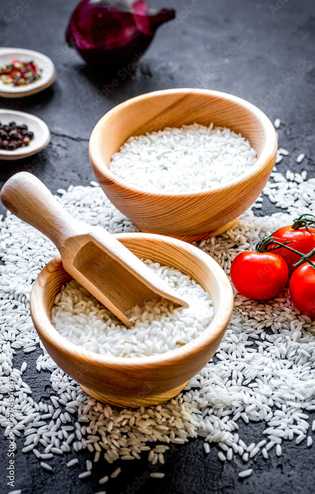 ingredients for paella on dark background