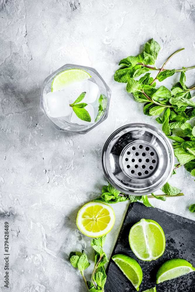 making mojito on stone background top view