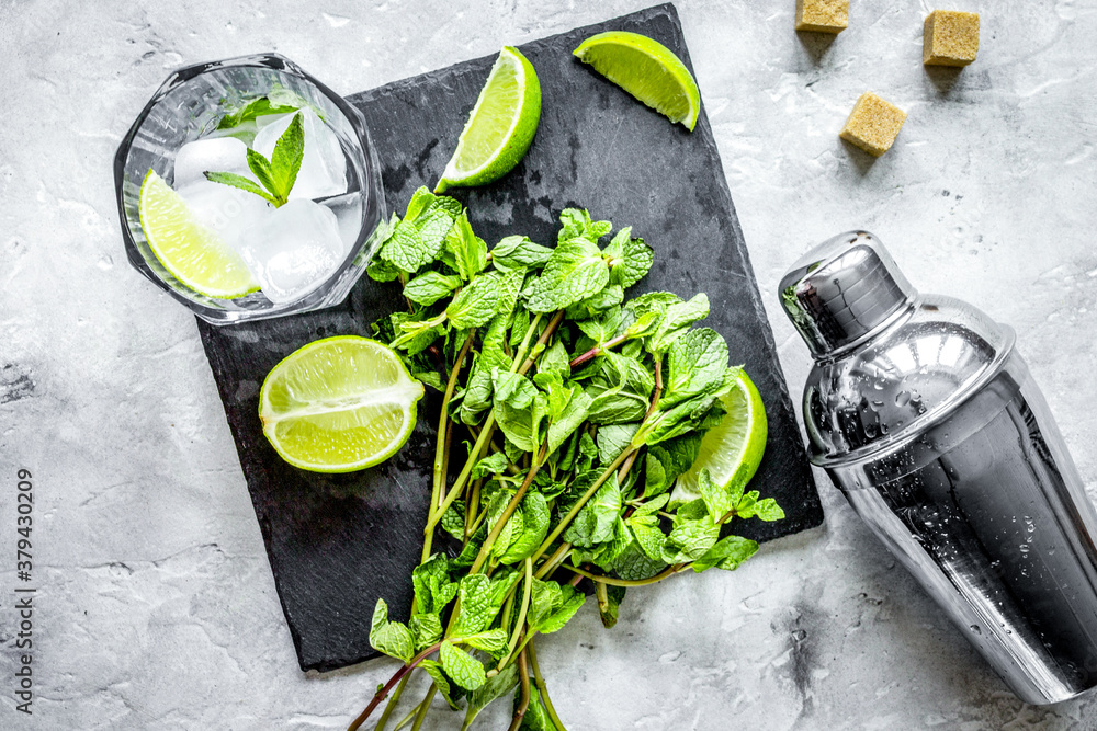 making mojito on stone background top view