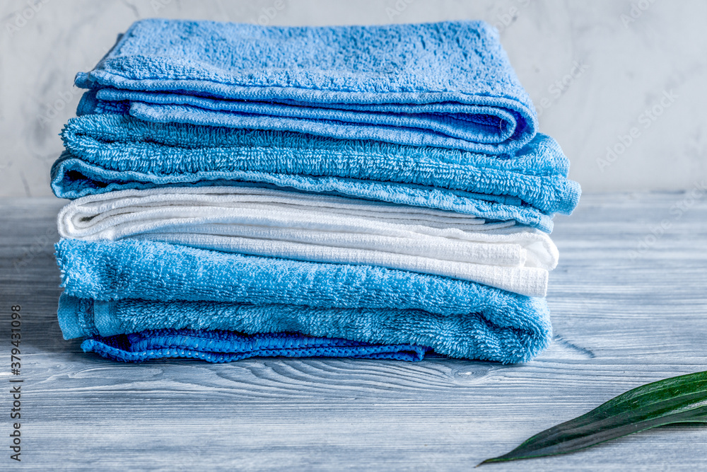 Towels pile in housekeeping set on laudry background mockup