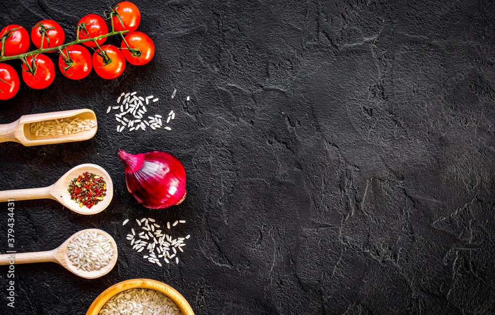 ingredients for paella on dark background top view