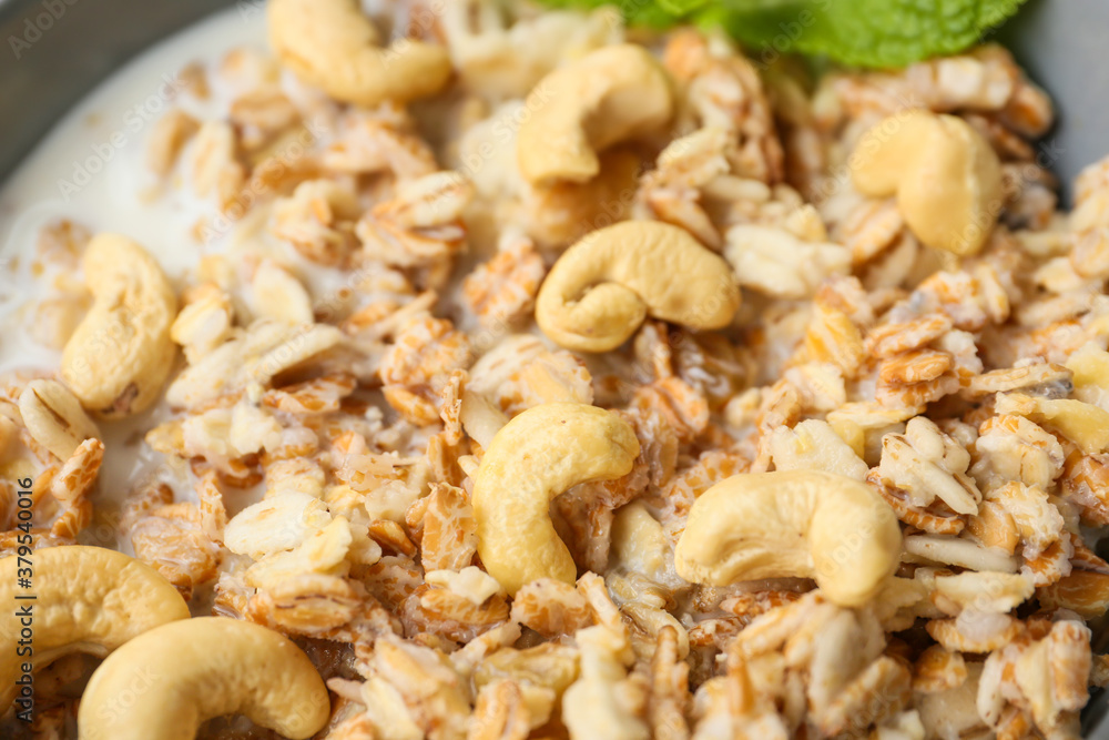 Bowl with tasty sweet oatmeal, closeup