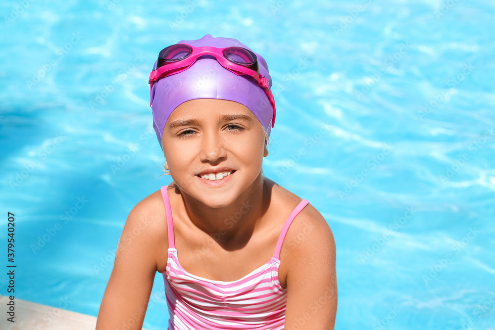 Cute little girl in swimming pool