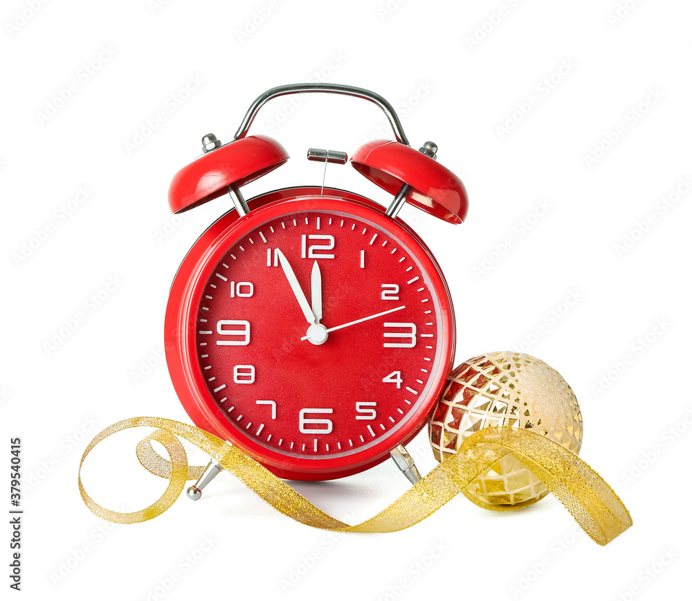 Alarm clock and Christmas decor on white background