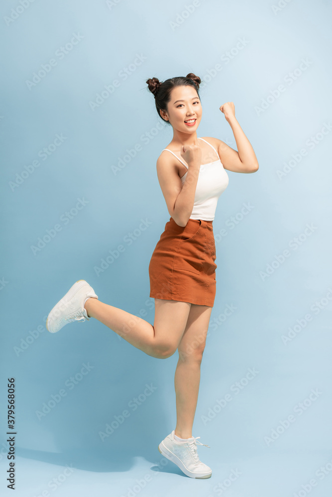 Full length size studio photo portrait of pretty sweet cute cheerful joyful lady standing on one leg