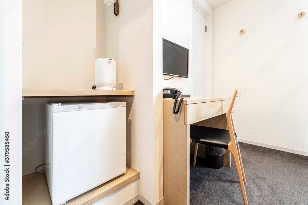 Small refrigerators and work area in a Japanese hotel room