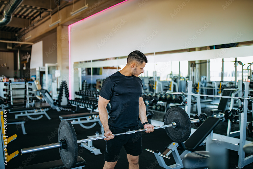 Modern gym, young man.