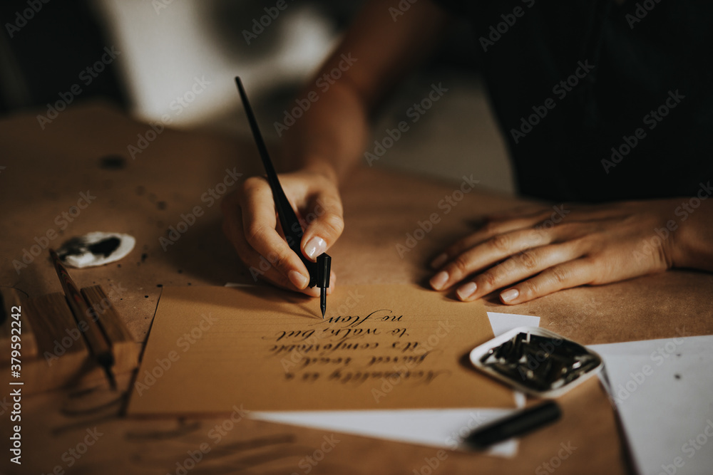 Writing a letter with old fashioned fountain pen.