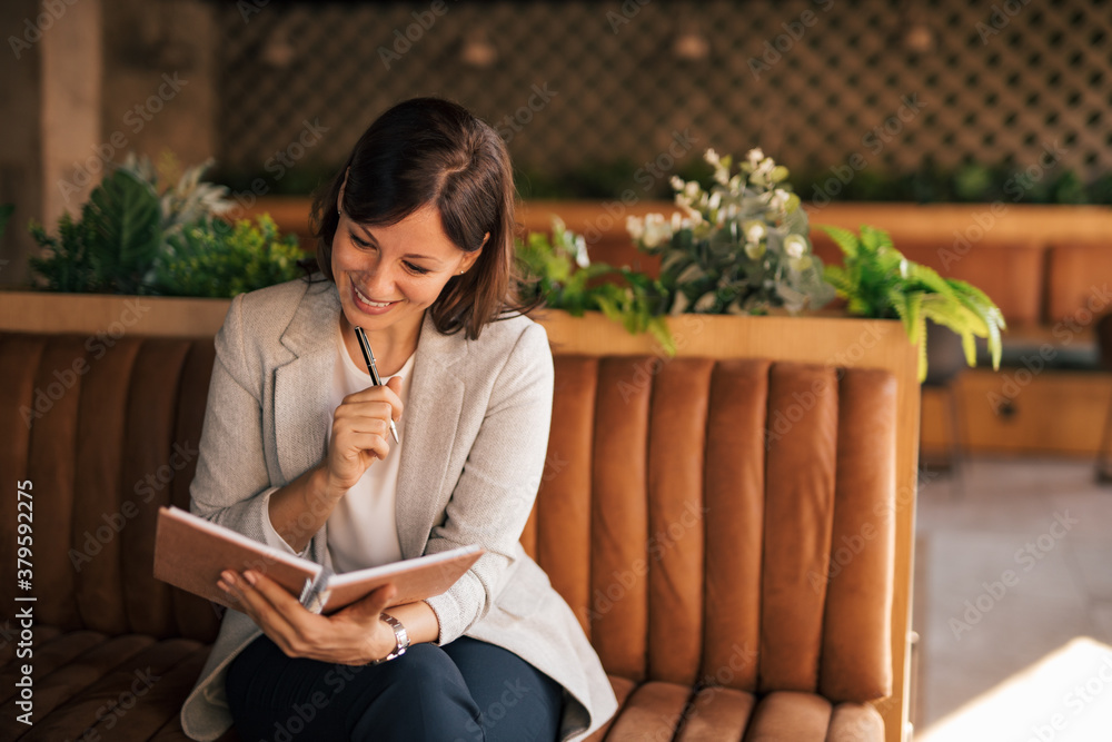 Making notes in her diary.