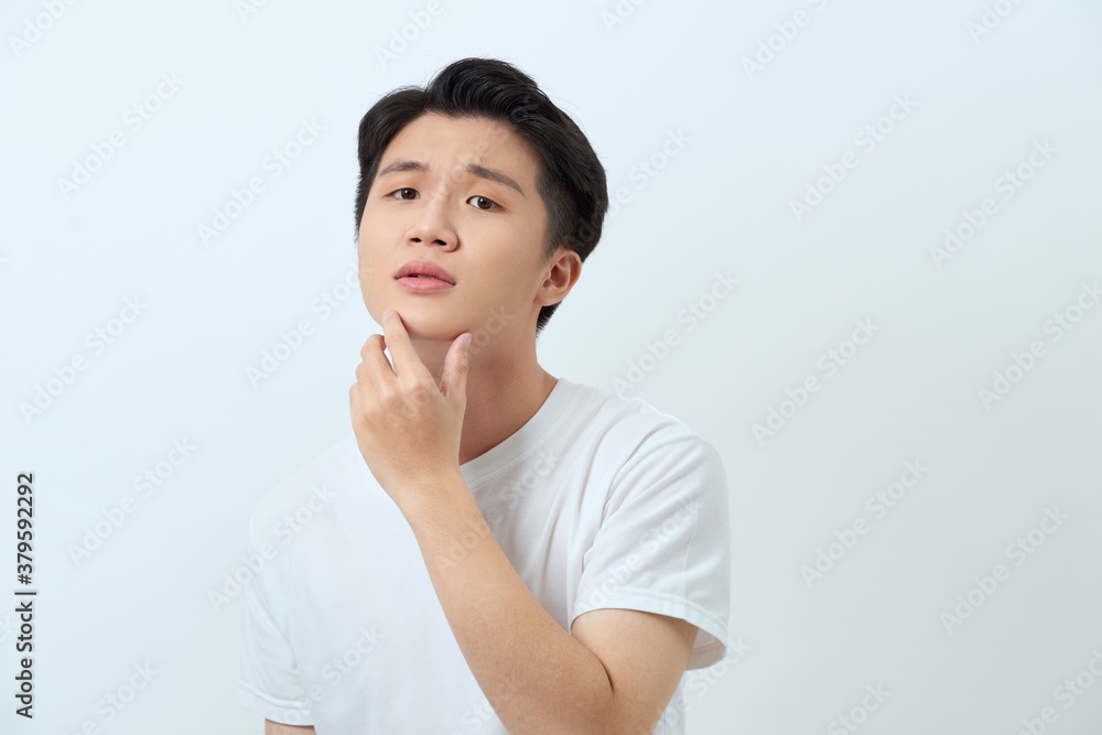 Young handsome man over white background looking confident at the camera smiling with hand raised on