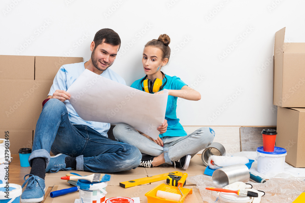 Young man and woman planning home renovation