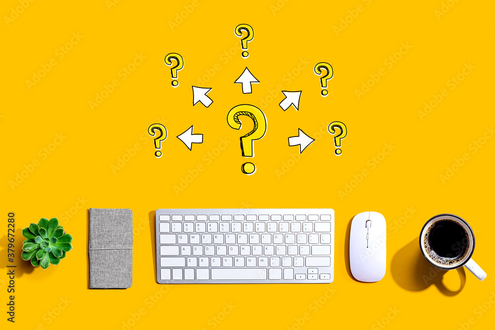 Big and small question marks with arrows with a computer keyboard and a mouse