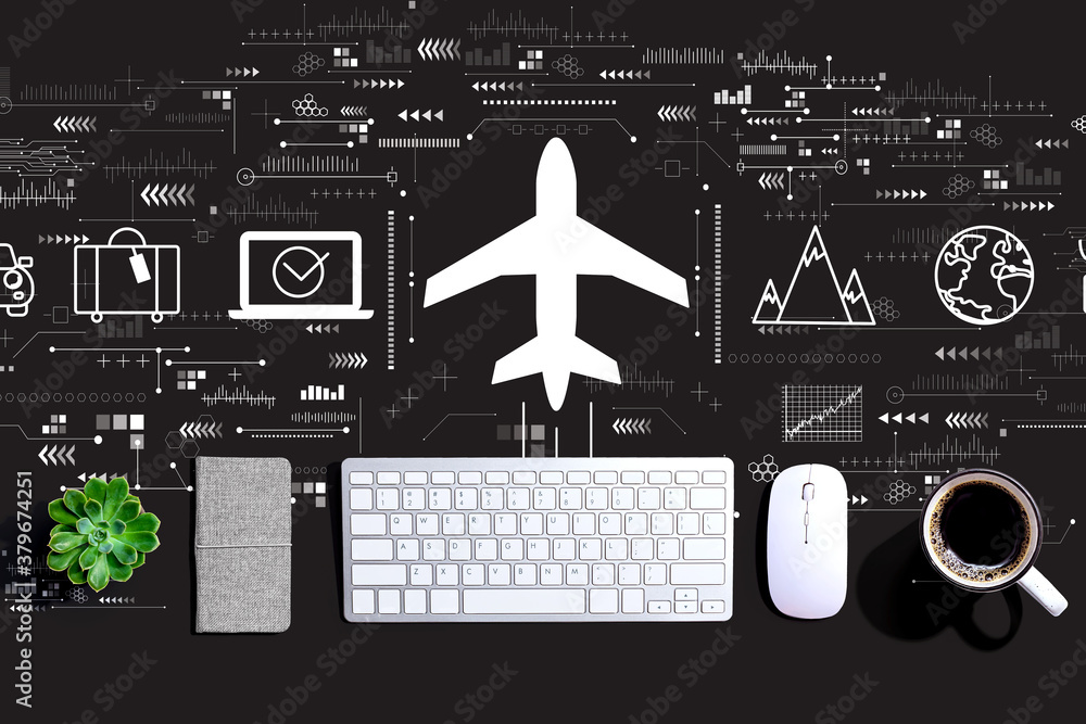 Flight ticket booking concept with a computer keyboard and a mouse