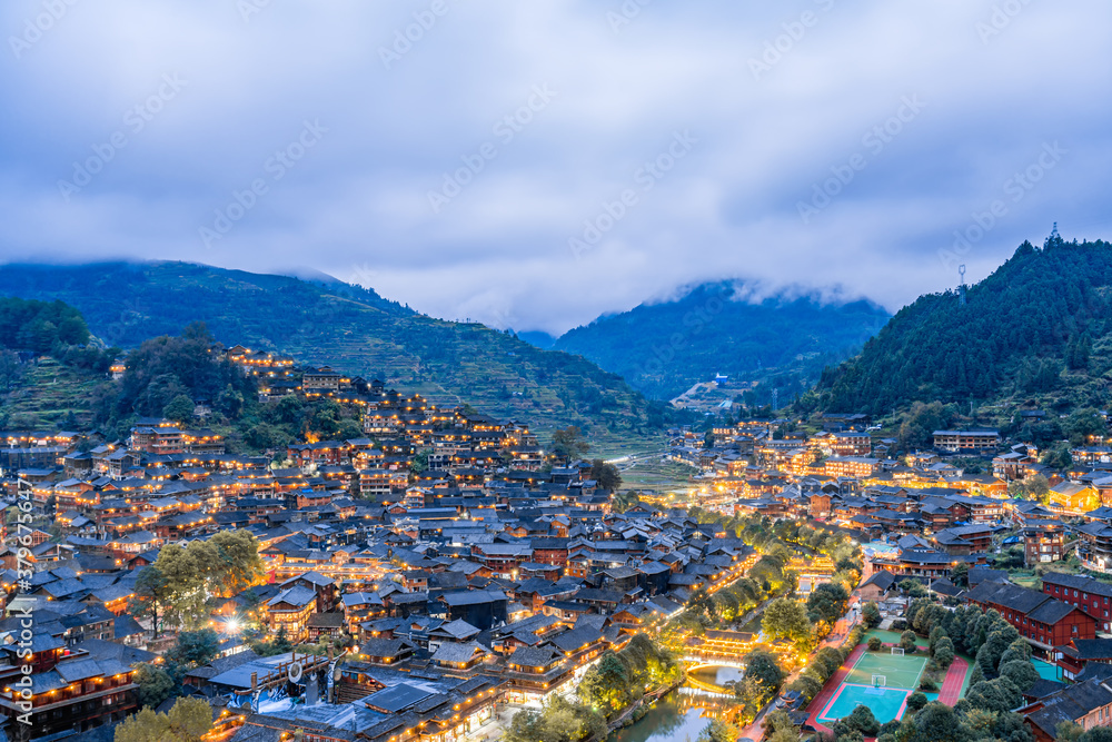 High-view night scenery of Qianhu Miao Village in Xijiang, Guizhou, China