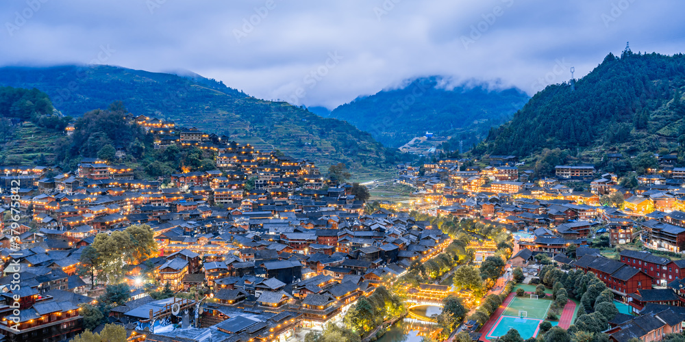 High-view night scenery of Qianhu Miao Village in Xijiang, Guizhou, China