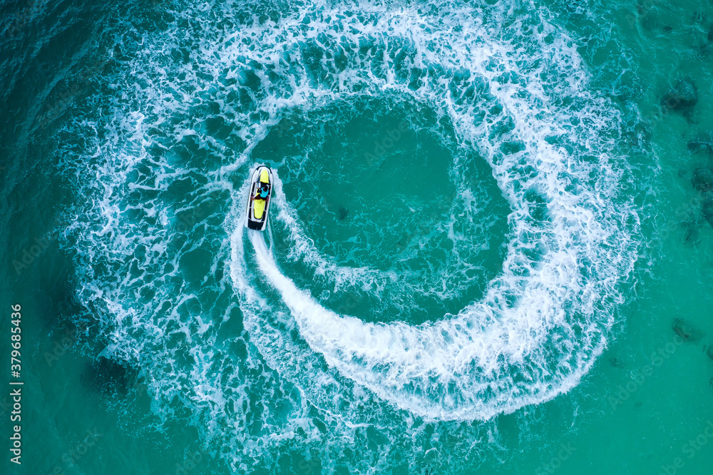 People are playing a jet ski in the sea.Aerial view. Top view.amazing nature background. The color o