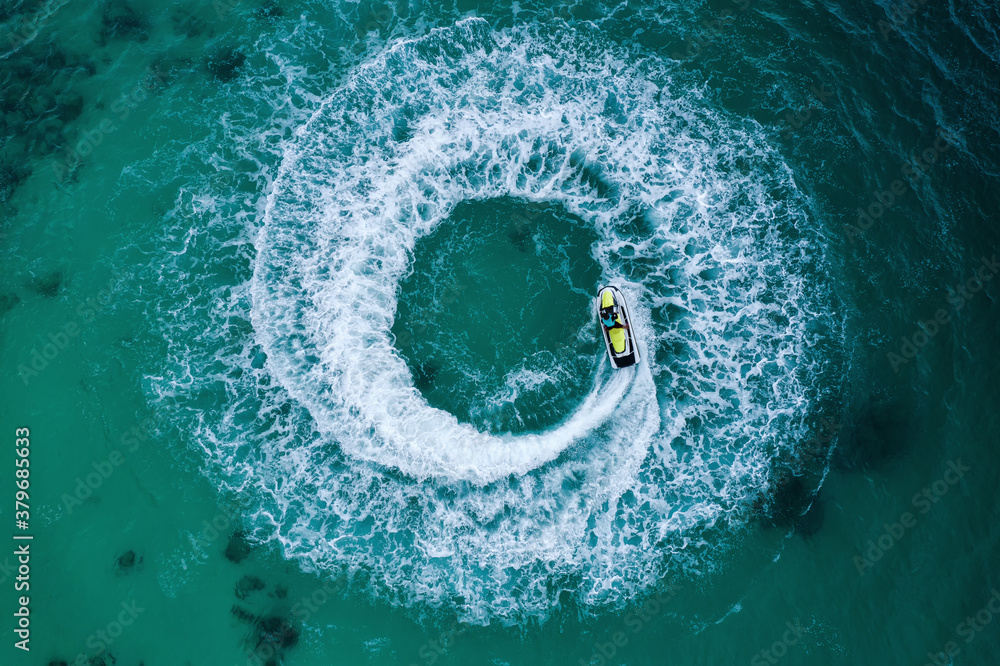 People are playing a jet ski in the sea.Aerial view. Top view.amazing nature background. The color o