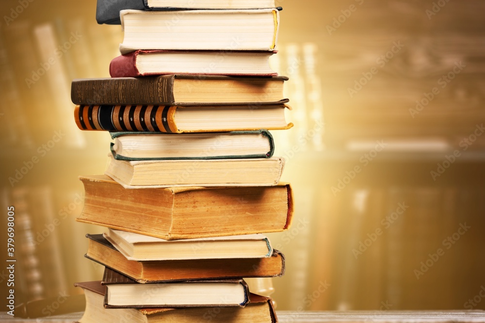 Collection stack of old retro books on background