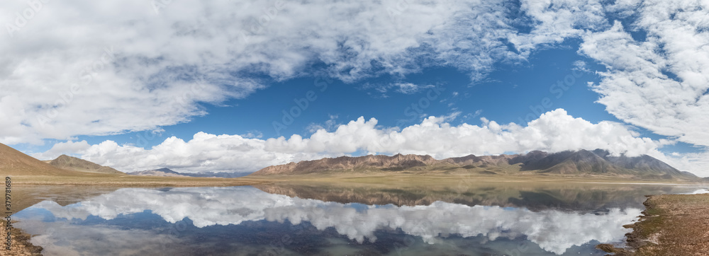 plateau lake and blue sky reflection panorama