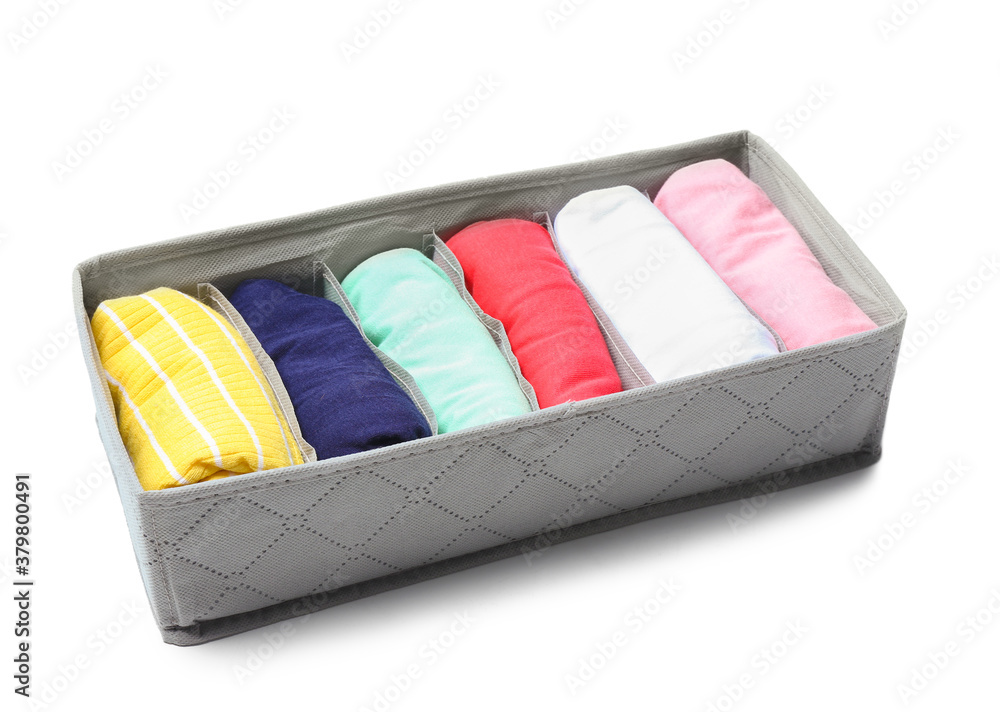 Organizer with clean clothes on white background