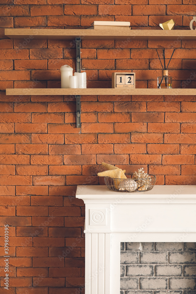 Modern fireplace with shelves in interior of room