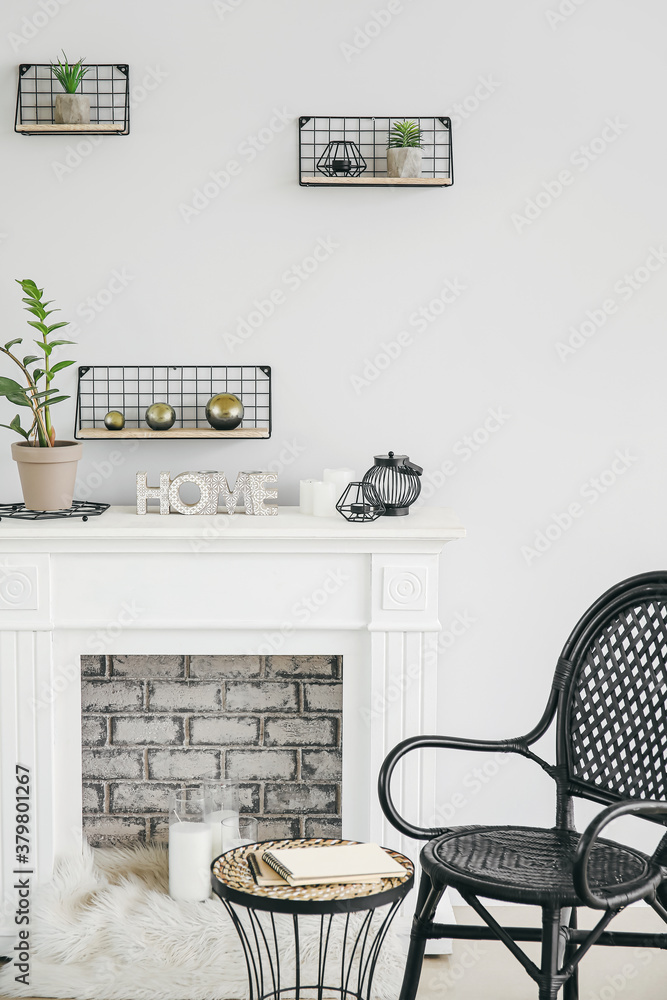 Modern fireplace with shelves in interior of room