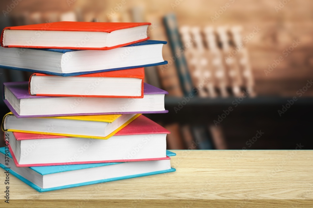 Stack of colorful books collection on the desk