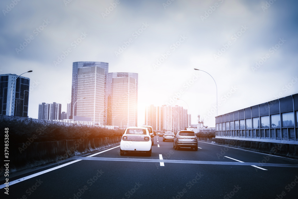 Highway overpass modern city skyline background .