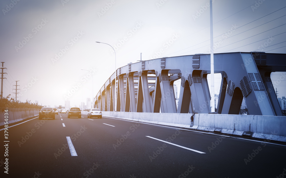 Highway overpass modern city skyline background .