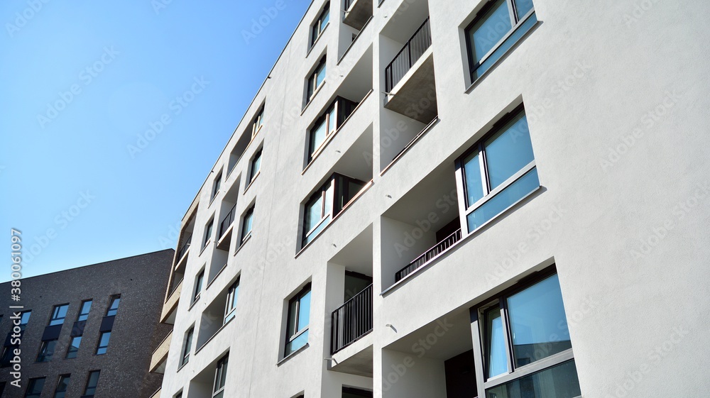 Multistoried modern, new and stylish living block of flats. Newly built apartment building.