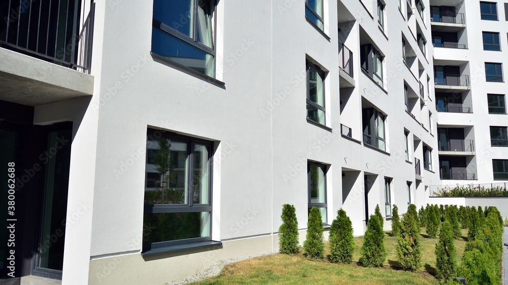 Multistoried modern, new and stylish living block of flats. Newly built apartment building.