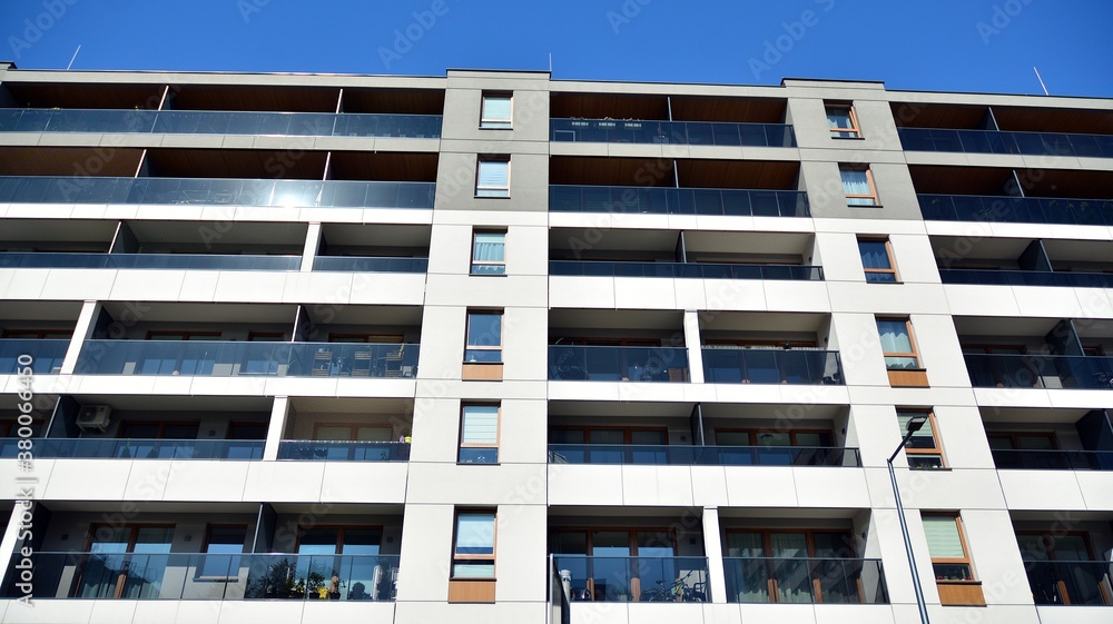 Multistoried modern, new and stylish living block of flats. Newly built apartment building.