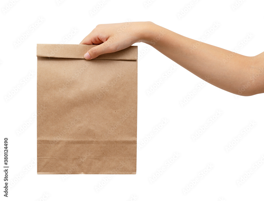 Womans hand holding a paper bag