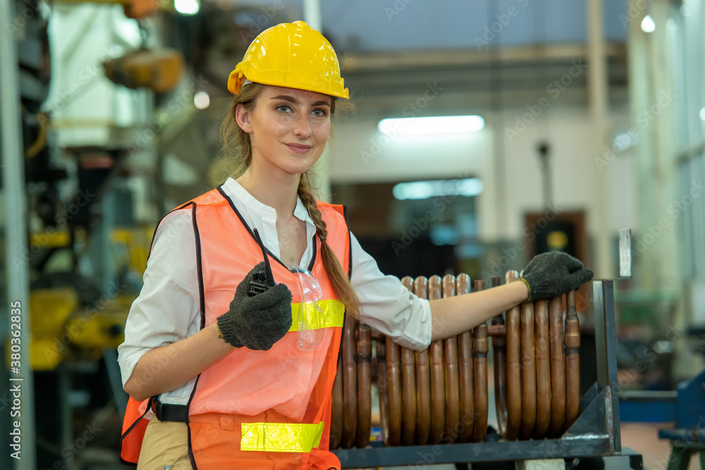 Portrait of woman engineer at industrial factory.