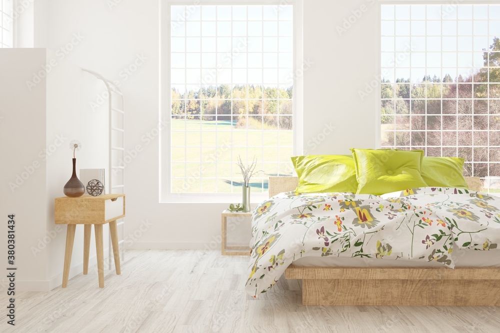 White stylish minimalist bedroom with armchair and autumn landscape in window. Scandinavian interior