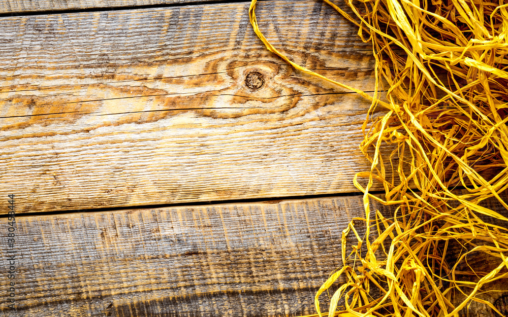 Straw on wooden table top view