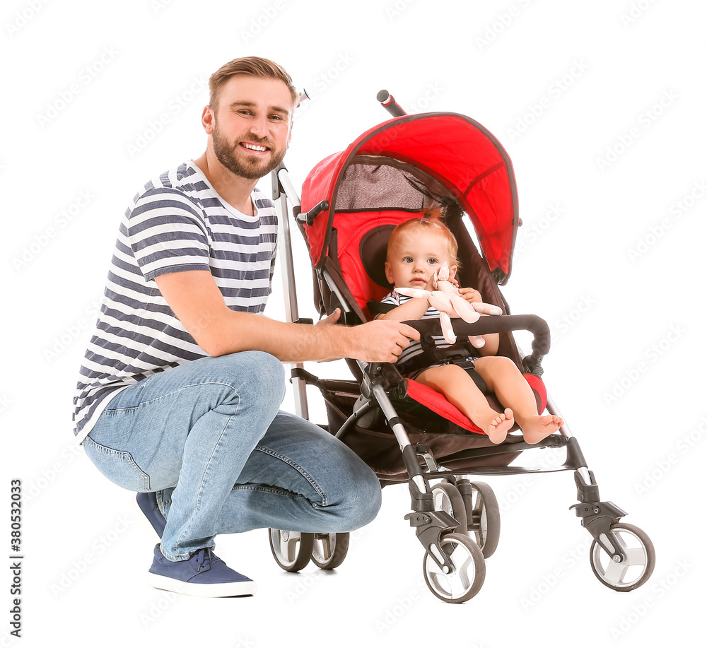 Father and his cute baby in stroller on white background