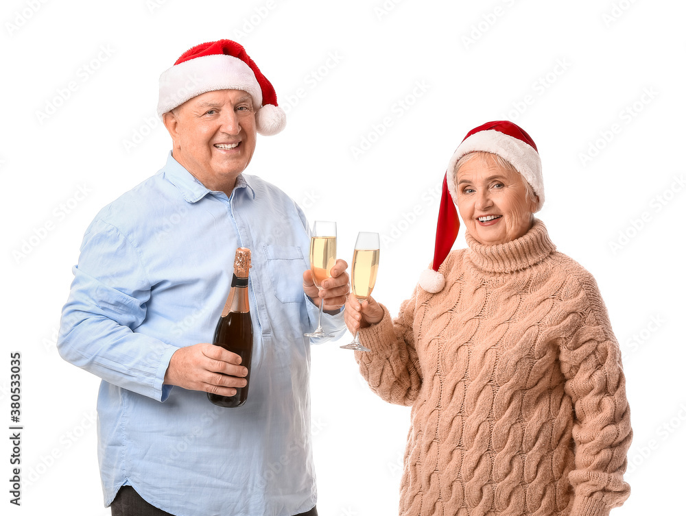 Elderly couple with champagne celebrating Christmas on white background