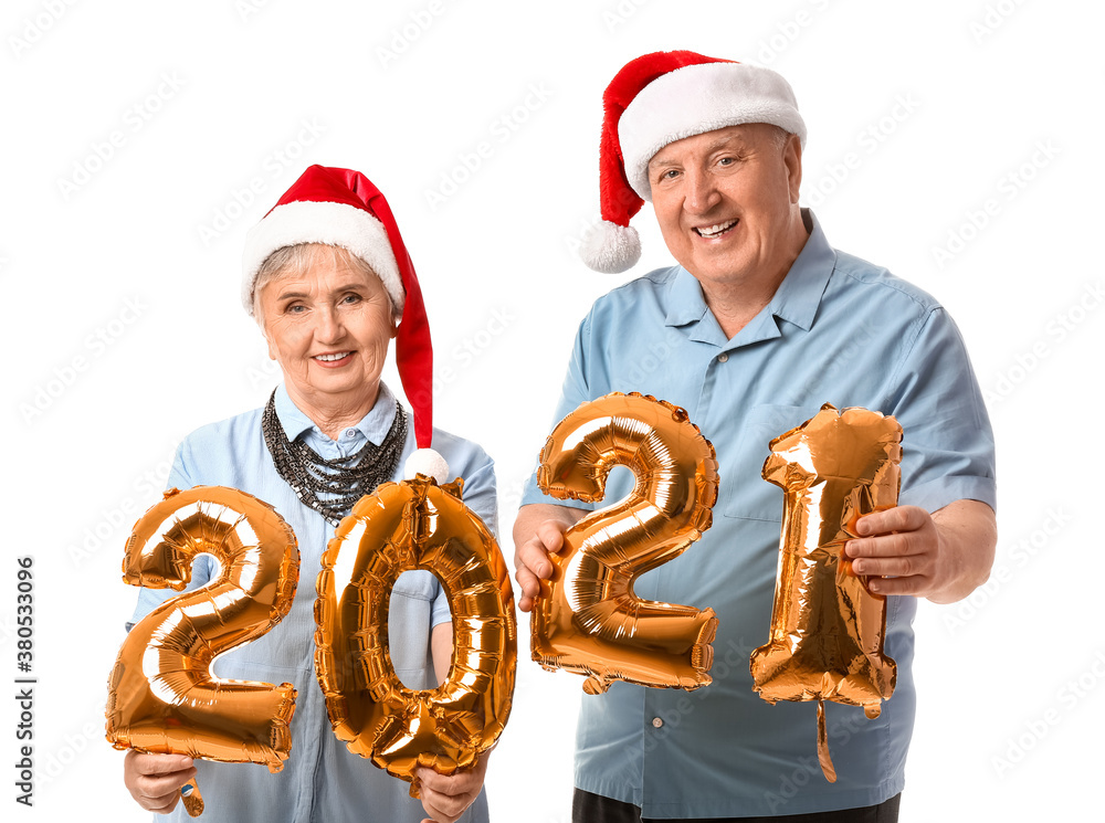 Elderly couple with figure 2021 on white background. New Year celebration