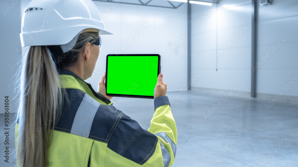 Industry 4.0 Modern Factory: Female Engineer Uses Digital Tablet Computer with Green Screen Mock-up 