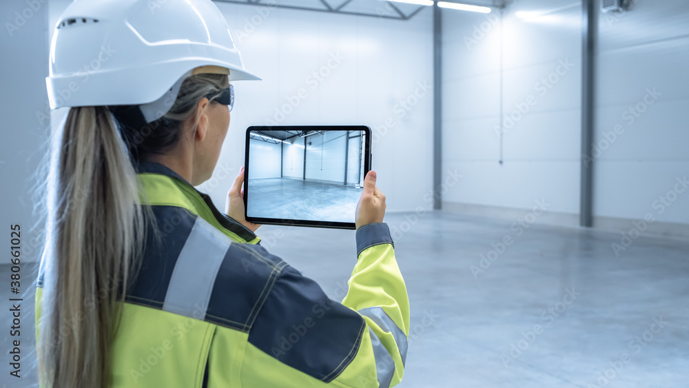 Industry 4.0 Modern Factory: Female Engineer Uses Digital Tablet Computer with Augmented Reality Sof