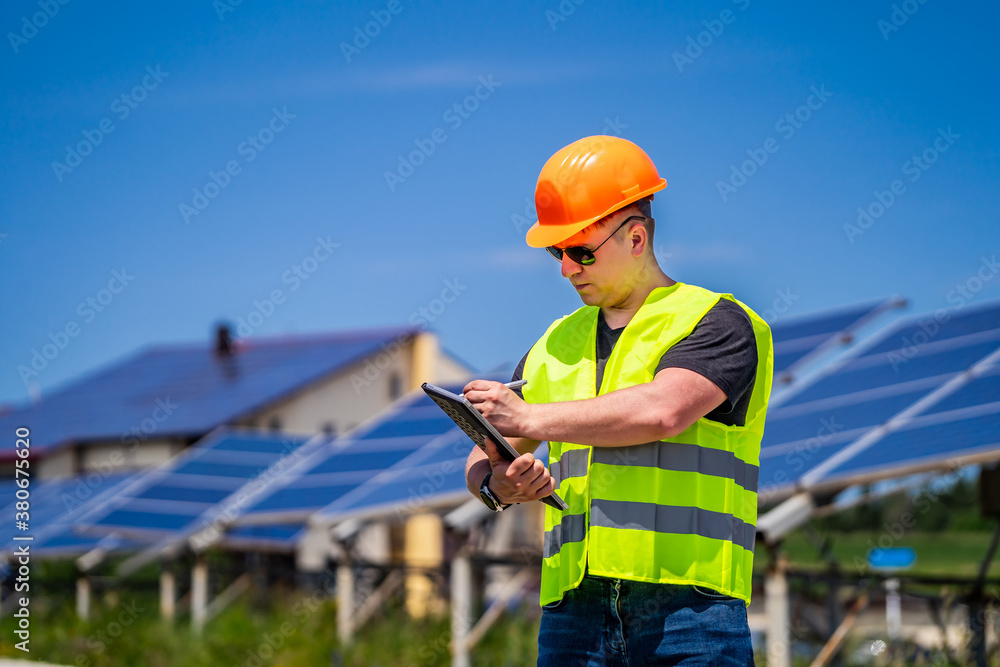 Expertise service worker on measuring efficiency of operation and maintenance at solar plant.